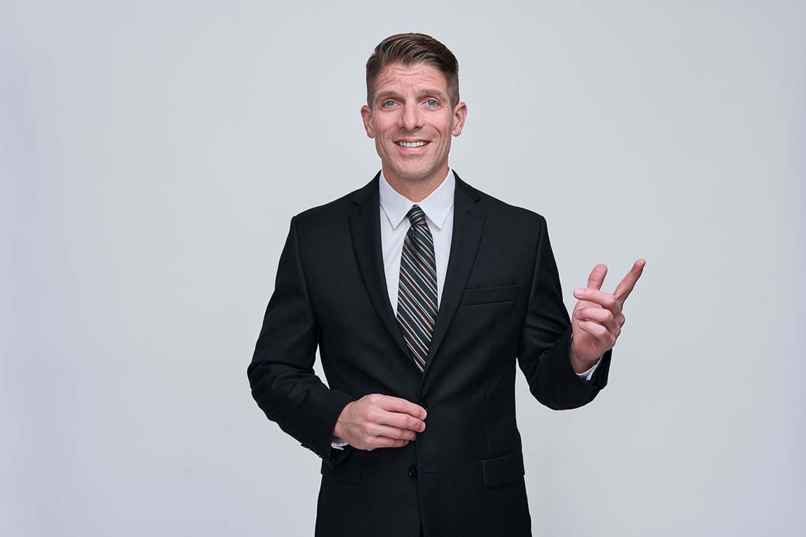 Businessman engaging corporate headshot white background NYC