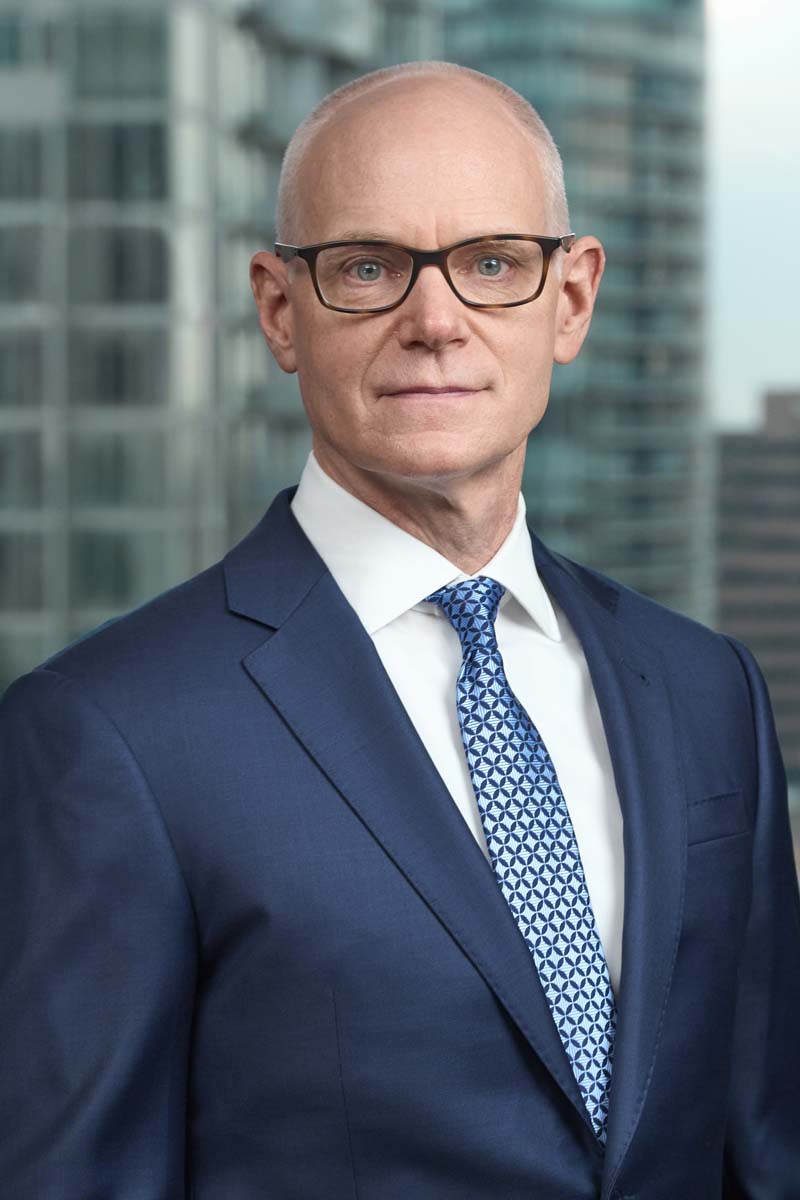 Senior businessman blue suit office window NYC