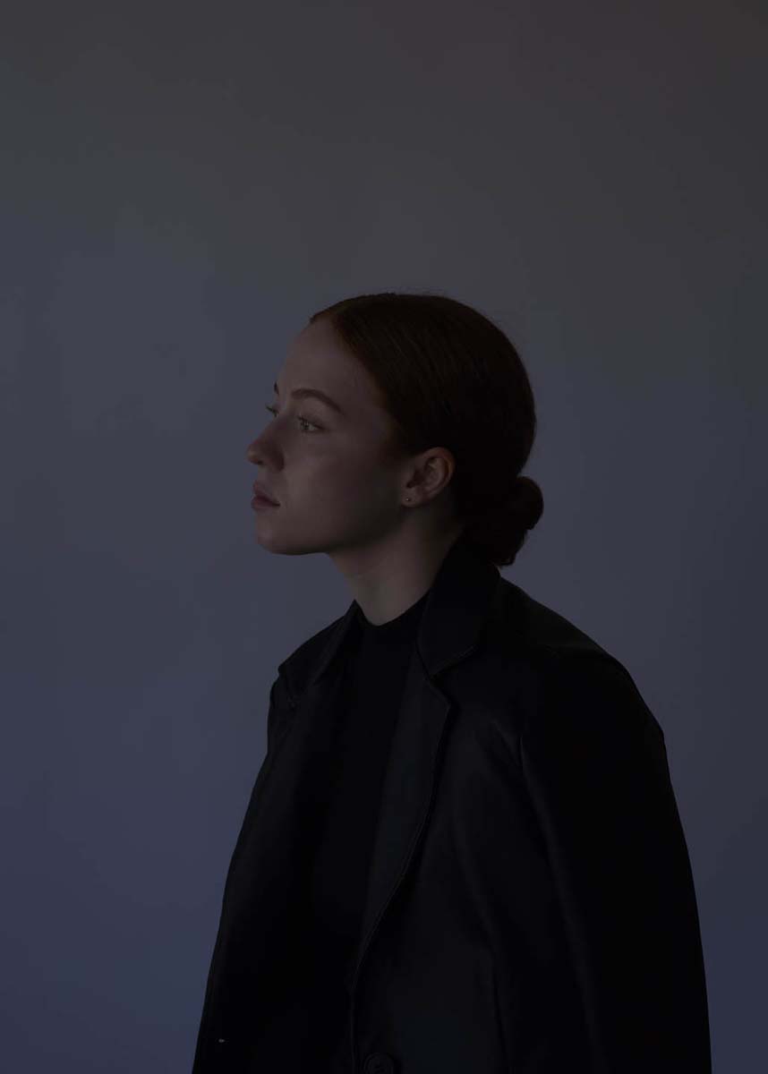 Redhead woman side profile dramatic editorial portrait NYC