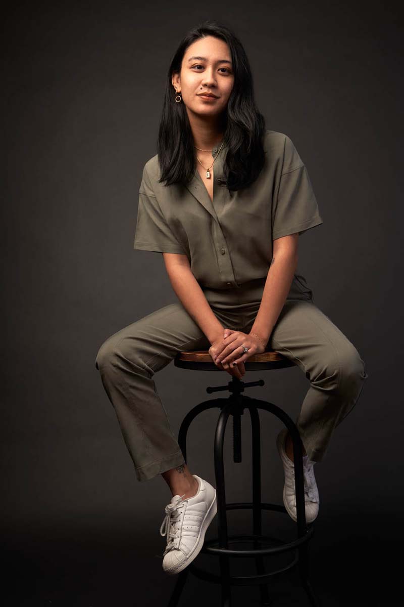 Young woman green jumpsuit casual lifestyle portrait NYC