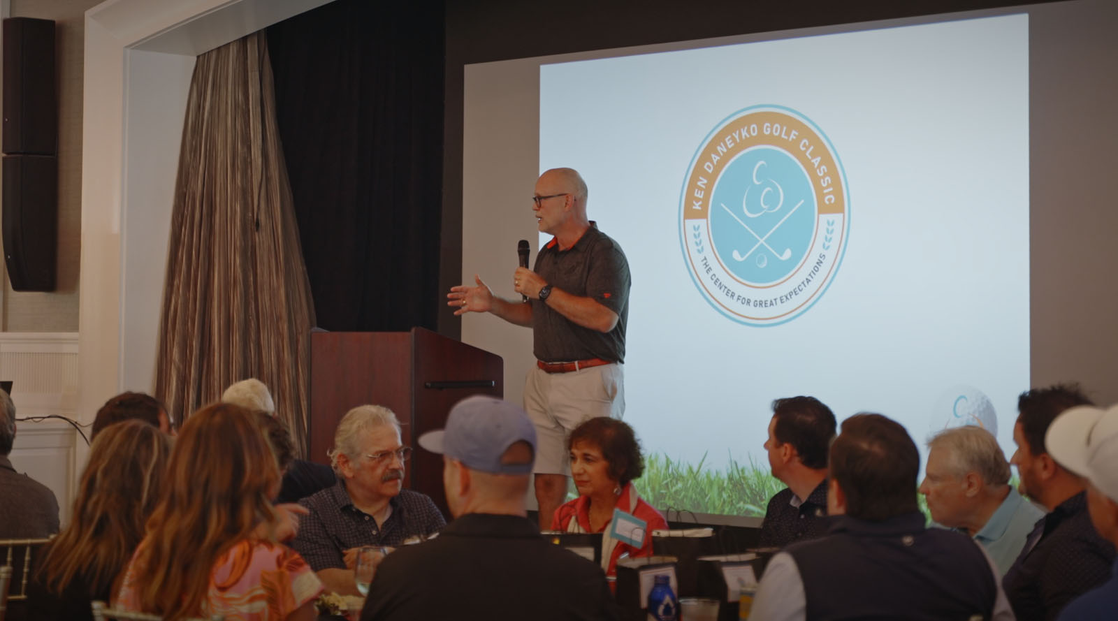 NYC conference speaker presenting to large audience professional event photography