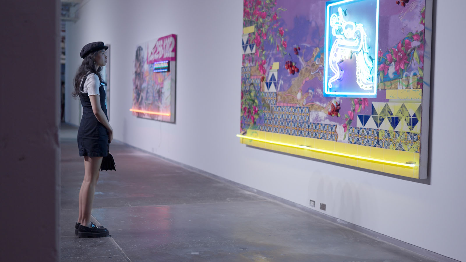 NYC art event attendee viewing colorful pop art gallery photography